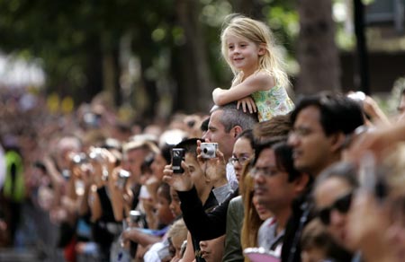 A young girl watches children's day at Notting Hill Carnival in London, August 27, 2006. The carnival which began in 1964 and starts on Sunday is one of the world's largest street parties with thousands of people expected to attend over the Bank Holiday weekend.