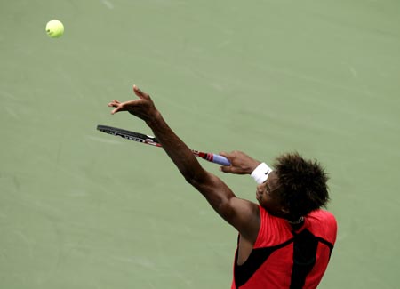 France's Gael Monfils serves to Michael Russell of the United States during their match at the U.S. Open tennis tournament in New York, August 30, 2006. 