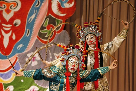 Chinese artists perform in an English version of the traditional Chinese opera Monkey King at a theatre in Shanghai December 8, 2006. Among the performers is Ghaffar Pourazar of Britain (not in photo), the first foreigner to complete the rigorous training at the Beijing Opera School and the National Academy. He is performing with Chinese artists from the International Centre for Beijing Opera, and other troupes, at their first show in Shanghai. 