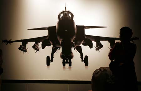 A woman stands in front of a Sweden