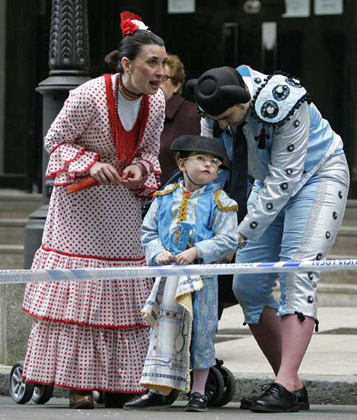 Revellers watch a Carnival parade in Oviedo, northern Spain, February 24, 2007.