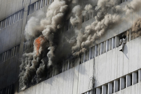 Men fall from building inferno