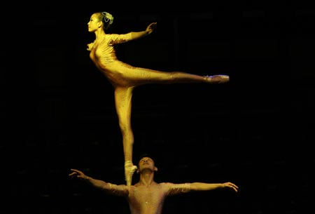 Members of the Zunyi Acrobatic Troupe from the Chinese National Acrobatic Circus perform during a show in Roquetas de Mar, southeast Spain, late August 12, 2007. 