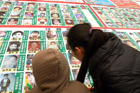 Poster with photos of 2,700 missing children