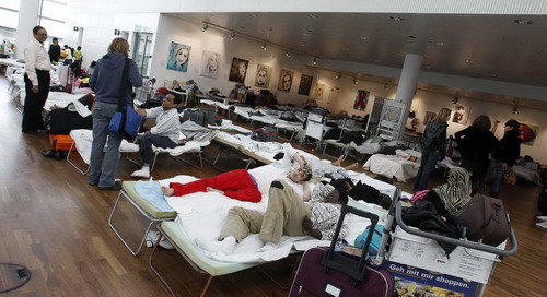 Stranded passengers wait at major Europe airports