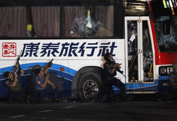 Philippine police assault hijacked bus