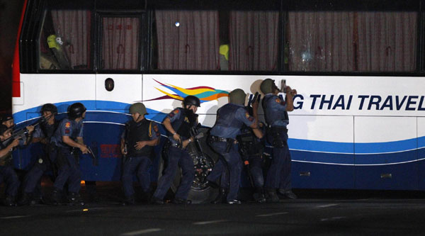 Philippine police assault hijacked bus