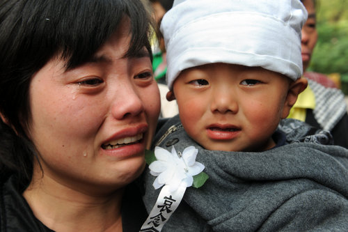 Tears for father and son stabbed to death