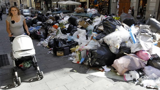Stinky garbage piles in Naples street, Italy