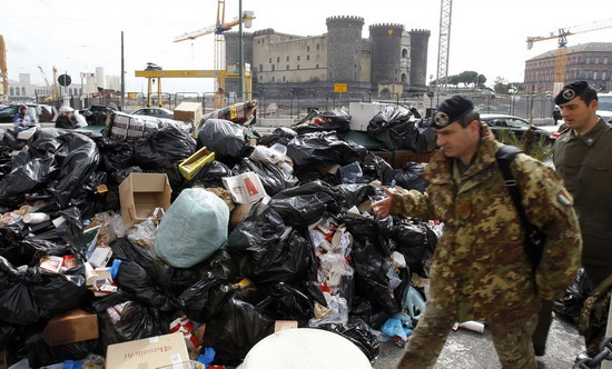 Stinky garbage piles in Naples street, Italy