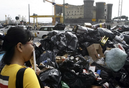Stinky garbage piles in Naples street, Italy