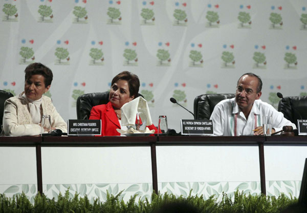 Cancun climate talks continue with protests