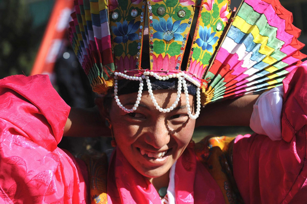 A Tibetan farmer prepares to join in a Tibetan Opera performance to celebrate the upcoming Serfs Emancipation Day in Zhanang county of Southwest China's Tibet autonomous region, March 26, 2011. Tibetans celebrate upcoming Serfs Emancipation Day
