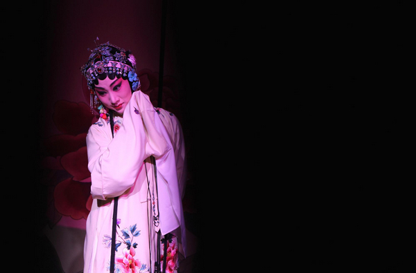 An actress from China's Shanghai Kunju Opera Company performs the Kunqu opera 'The Peony Pavilion' during the Shanghai Culture Month in Paris, capital of France, April 18, 2011. Kunqu opera staged in Paris