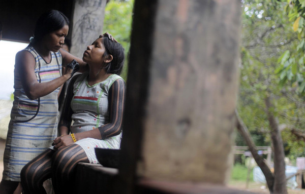 Body painting for Kayapo people in N Brazil