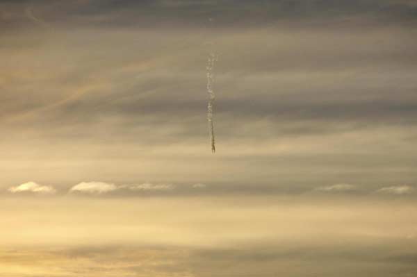 In this photograph taken by Bolivian glaciologist Edson Ramirez, an object crosses the sky as it appears to fall leaving a trail over Andean mountain peaks Huayna Potosi and Tuni Condoriri, where Ramirez was studying glaciers, August 16, 2011. According to planetary expert Rubber Munoz Sanchez of the Max Schreier Planetarium in La Paz, the object was a meteor of up to 50 cm (20 inches) in diameter, burning due to friction with the atmosphere. Picture taken August 16, 2011. Glaciologist captures meteor's fall