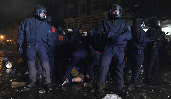 Police forces arrest a demonstrator during clashes at the so-called street party 'Schanzenfest' in the Schanze district in Hamburg August 20, 2011. Demonstrators clash with police in Hamburg