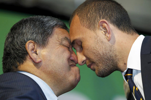 Australia's Quade Cooper (R) exchanges a Hongi with a member of the welcoming party during a welcome ceremony for the Australia Rugby World Cup team in Auckland September 6, 2011. Hongi greeting ahead of Rugby World Cup