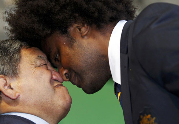 Australia's Radiki Samo (R) exchanges a Hongi with a member of the welcoming party during a welcome ceremony for the Australia Rugby World Cup team in Auckland September 6, 2011.[ Hongi greeting ahead of Rugby World Cup