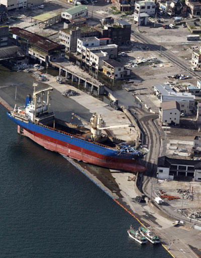 The Asia Symphony cargo ship, which was swept ashore by the March 11 earthquake and subsequent tsunami, is seen at the port in Kamaishi, Iwate prefecture, September 7, 2011. Remains of the March 11 disaster in Japan
