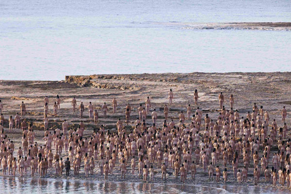 Naked volunteers pose for American photographer Spencer Tunick on the shore of the Dead Sea in Israel, which is the lowest point on earth, September 17, 2011. Tunick in Israel for naked Dead Sea photo