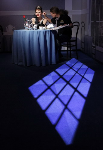 An artist puts finishing touches to a wax figure of actress Audrey Hepburn during a photo opportunity, a day before the opening of Madame Tussauds' Japan exhibition, in Tokyo Sept 27, 2011. Madame Tussauds exhibition opens in Japan