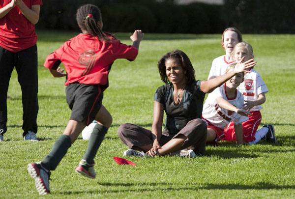 First Lady Michelle Obama hosts a 'Let's Move!' clinic with members of the US women's soccer team to teach kids soccer skills and highlight the importance of physical activity on the South Lawn of the White House in Washington October 6, 2011. US first lady shows off soccer skills at WH