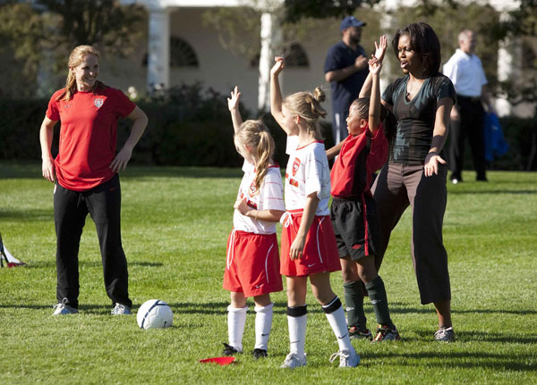 First Lady Michelle Obama hosts a 'Let's Move!' clinic with members of the US women's soccer team to teach kids soccer skills and highlight the importance of physical activity on the South Lawn of the White House in Washington October 6, 2011. US first lady shows off soccer skills at WH