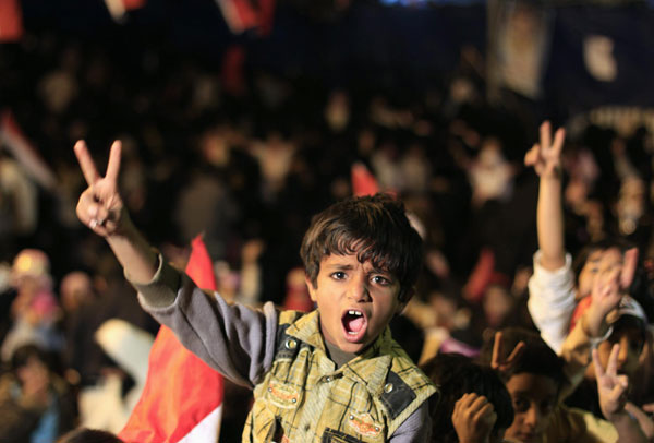 A boy shouts anti-government slogans during a ceremony commemorating the 48th anniversary of a revolution that liberated the south of Yemen from British rule, at Taghyeer (Change) Square in Sanaa Oct 13, 2011. Protesters demand ouster of Yemen's president