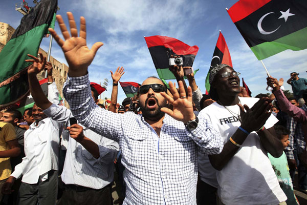 Libyans celebrate at Martyrs square in Tripoli Oct 20, 2011 after hearing the news that Libyan leader Muammar Gadhafi was killed in Sirte. Gadhafi died in an attack by NTC fighters, a senior NTC official said on Thursday. Libya people celebrate as Gadhafi killed