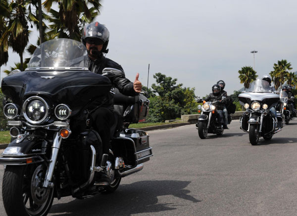 Harley-Davidson fans take part in a parade as the first festival held for the motorcycle enthusiasts in Rio de Janeiro, Brazil comes to a close, Nov 6, 2011. The festival started on Nov 4. Harley fans roar to the sound of samba in Brazil