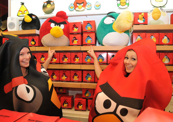 People dressed in Angry Birds costumes pose for photos at the first official Angry Birds store, which opened in Helsinki on Friday. 1st Angry Birds shop opens in its birthplace
