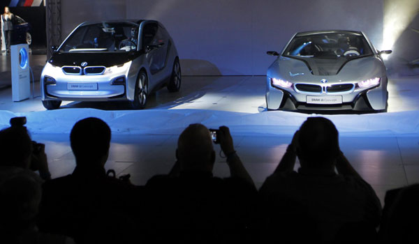 The BMW i3 electric concept vehicle (L) and the i8 hybrid-electric concept vehicle are seen on their North American debut at the LA Auto Show in Los Angeles Nov 16, 2011. BMW electric concept vehicle shown