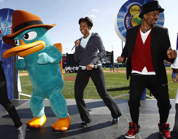 US first lady Michelle Obama plays mini-tennis during a 'Let's Move!' faith and communities physical activity at Disney World's ESPN Wide World of Sports in Orlando, Florida. 'Let's Move' with US first lady
