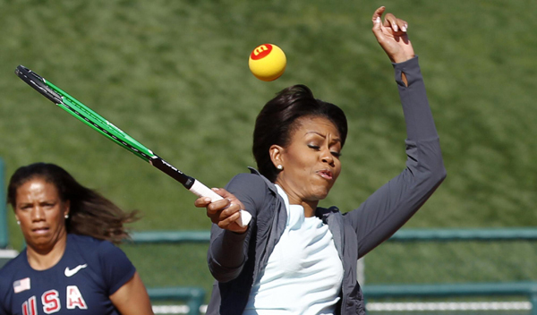 US first lady Michelle Obama plays mini-tennis during a 'Let's Move!' faith and communities physical activity at Disney World's ESPN Wide World of Sports in Orlando, Florida. 'Let's Move' with US first lady