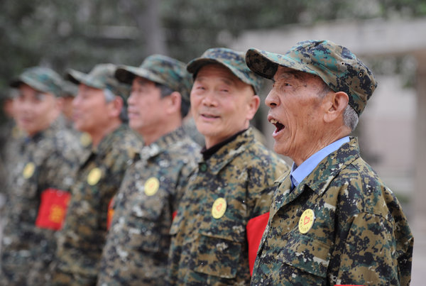 A team of veteran volunteers follow orders during training at Tangyuan Community in Xi’an, April 9, 2012. Weekly Photos: April 9 - 15
