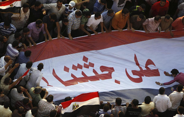 Supporters of Morsy protest against army in Cairo