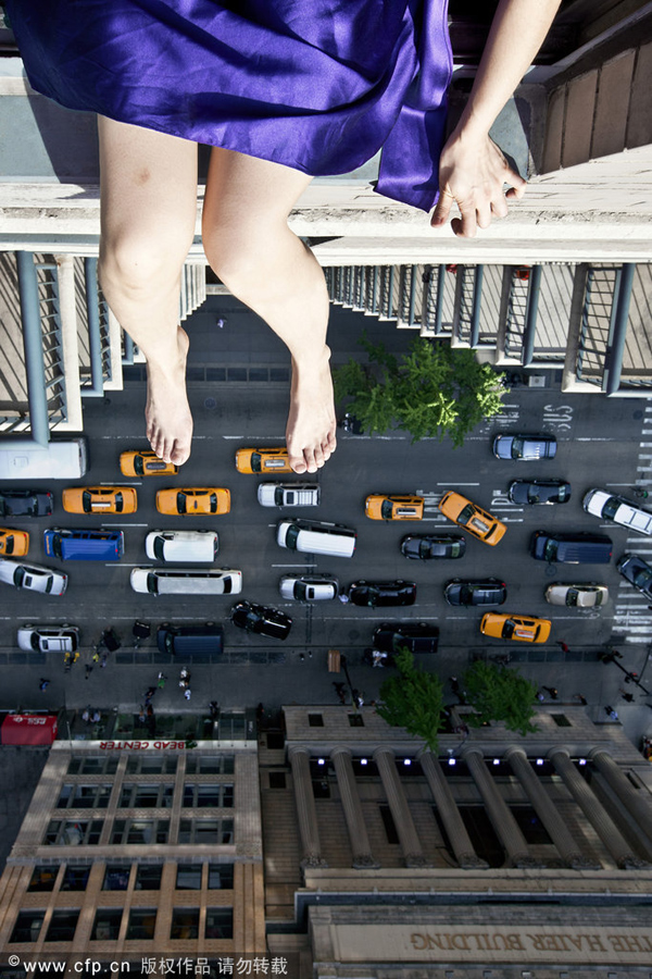 Artist Jun Ahn has a head for heights and an eye for breathtaking shots as she dangles her feet from a New York skyscraper. Living life on the edge