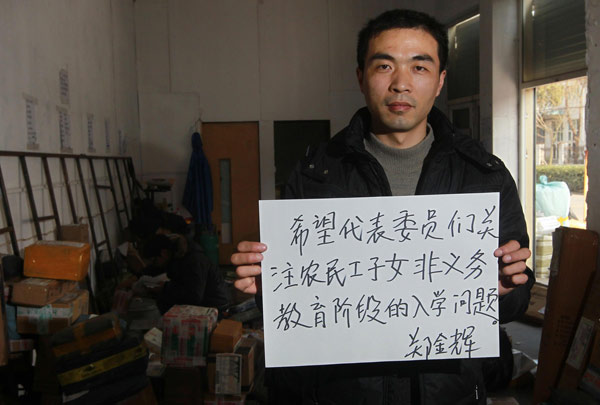 “I hope NPC deputies and CPPCC members could pay more attention to the school enrollment problem of migrant workers’ children,” Zheng Jinhui, a manager of an express company in Shanghai, Feb 27, 2013. Sign of times from people to congress