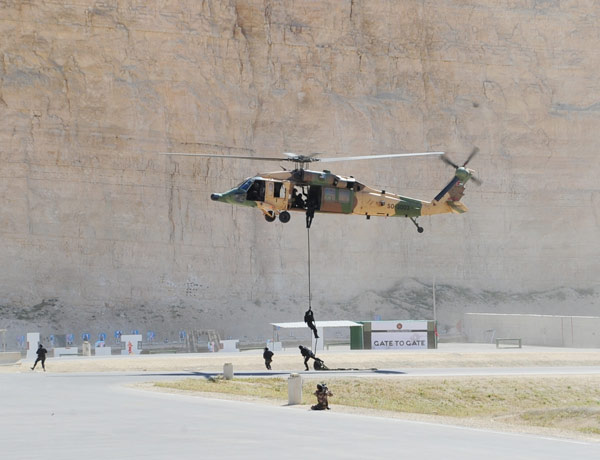 An anti-terror drill held by the Jordanian Armed Forces at King Abdullah Special Operation Training Center in Amman, March 24, 2013. Olympics for world's Special Forces