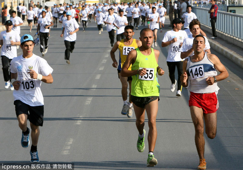 Runners compete in the second International Iraqi Marathon in the northern Kurdish city of Arbil, on Oct 19, 2012. Public sports in post-war Iraq