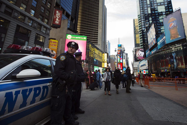 New York Police Department officers stand in the Times Square district of New York during an increase in security following fatal explosions in Boston, April 15, 2013. Security beefed up in US after Boston blast