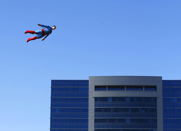 A radio-controlled Superman plane is flown by designer Otto Dieffenbach during a test flight in San Diego, California June 27, 2013. It's a bird, it's a Superman plane