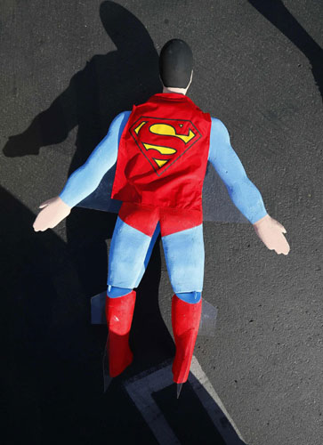 A radio-controlled Superman plane is flown by designer Otto Dieffenbach during a test flight in San Diego, California June 27, 2013. It's a bird, it's a Superman plane