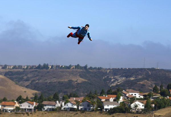 A radio-controlled Superman plane is flown by designer Otto Dieffenbach during a test flight in San Diego, California June 27, 2013. It's a bird, it's a Superman plane