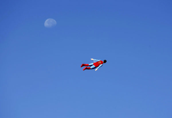 A radio-controlled Superman plane is flown by designer Otto Dieffenbach during a test flight in San Diego, California June 27, 2013. It's a bird, it's a Superman plane