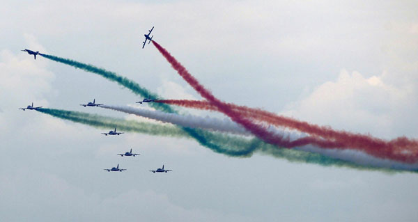 Members of the Italian aerobatic team Frecce Tricolori perform during the AirPower 13 air show at the Hinterstoisser air base in Zeltweg June 28, 2013. Over 200,000 spectators are expected to attend the air show which takes place June 28 to 29. Austrian air show opens