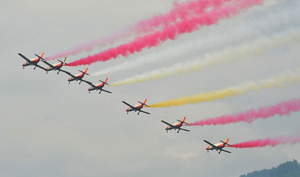 Members of the Spanish aerobatic team Patrulla Aguila perform during the AirPower 13 air show at the Hinterstoisser air base in Zeltweg June 28, 2013. Austrian air show opens