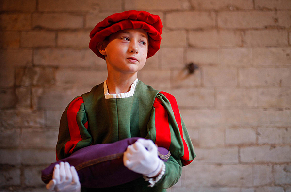 A young actor waits for the start of the Ommegang parade at Grand Place, the central square of Brussels, Belgium, on July 4, 2013. Parade re-creates medieval scene in Belgium