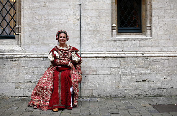 An actress waits for the start of the Ommegang parade at Grand Place, the central square of Brussels, Belgium, on July 4, 2013. Parade re-creates medieval scene in Belgium